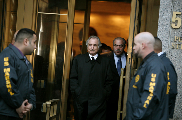 January 2009, New York, N.Y. - Disgraced financier Bernard Madoff, center, leaves federal court in Manhattan after appearing at a bail hearing. : News Singles : Jason DeCrow Photojournalist