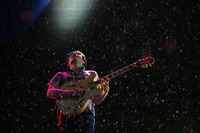 July 2009, Jersey City, N.J. - Lead singer Ezra Koenig performs with Vampire Weekend in a heavy downpour during the All Points West music festival at Liberty State Park.