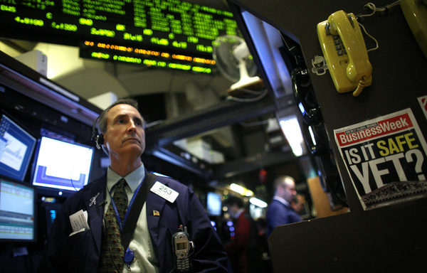 April 2009, New York, N.Y. - A trader works on the floor of the New York Stock Exchange.  : News Singles : Jason DeCrow Photojournalist