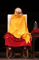 May 2010, New York, N.Y. - The Dalai Lama jokingly wraps his robe around his head as he speaks during a panel discussion at the Cathedral Church of Saint John the Divine.