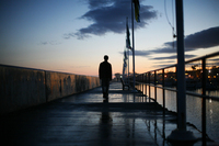 April 2010, Santa Barbara, Calif. - A man walks along the breakwater surrounding Santa Barbara Harbor.