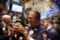 December 2008, New York, N.Y. - Holly, an orphaned puppy up for adoption, gets some attention from Thomas Kay after representatives of the Helen Woodward Animal Center and the Iams Home 4 the Holidays pet adoption campaign rang the opening bell at the New York Stock Exchange to celebrate the campaign's 966,284th adoption.