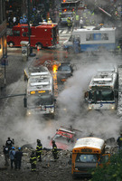 July 2007, New York, N.Y. - Police, firefighters and ConEdison workers respond to the scene of an underground steam pipe explosion on Lexington Avenue at 41st Street.
