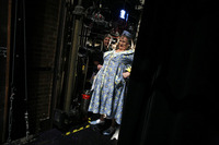 Waiting in the wings, Fierstein smiles as he watches his costars rehearse.