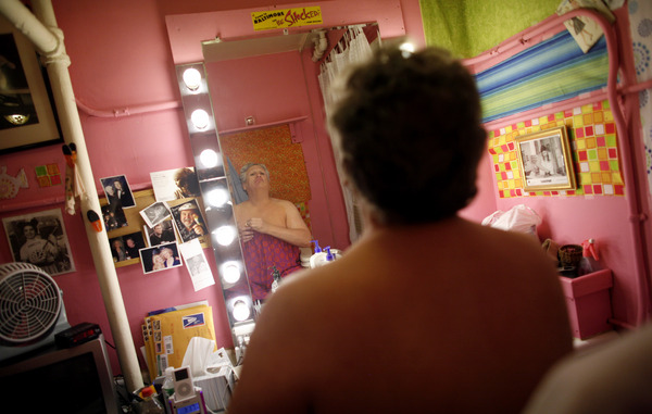 Days before returning to reprise his Tony Award-winning role as Edna Turnblad in the musical "Hairspray," actor Harvey Fierstein participated in a full dress rehearsal at the Neil Simon Theater, transforming himself from leading man into leading lady.  Here, body makeup is applied. : Transforming Harvey : Jason DeCrow Photojournalist