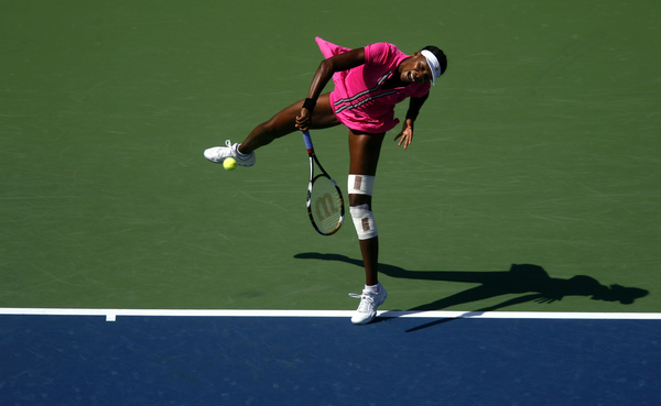 September 2009, Flushing, N.Y. - Venus Williams, of the United States, serves against compatriot Bethanie Mattek-Sands during the second round of the US Open at the USTA Billie Jean King National Tennis Center. : Sports Singles : Jason DeCrow Photojournalist
