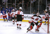 March 2009, New York, N.Y. - New Jersey Devils goalie Martin Brodeur, right, reacts after giving up a goal to New York Rangers center Brandon Dubinsky, celebrating with teammates at left, which put the Rangers up 1-0 over the Devils during an NHL hockey game at Madison Square Garden.