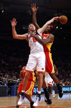 March 2010, New York, N.Y. - New York Knicks #8 Danilo Gallinari, left, collides in midair with Houston Rockets #27 Jordan Hill during an NBA basketball game at Madison Square Garden. : Sports Singles : Jason DeCrow Photojournalist