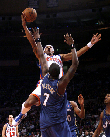 April 2010, New York, N.Y. - New York Knicks #4 J.R. Giddens goes to the basket against Washington Wizards #7 Andray Blatche during an NBA basketball game at Madison Square Garden. : Sports Singles : Jason DeCrow Photojournalist