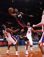 April 2010, New York, N.Y. - Miami Heat #3 Dwayne Wade draws a foul on his way to the basket against New York Knicks #1 Chris Duhon, left, during an NBA basketball game at Madison Square Garden.