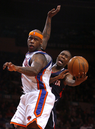 March 2010, New York, N.Y. - New York Knicks #7 Al Harrington, left, defends Atlanta Hawks #11 Jamal Crawford as he tries to shoot during an NBA basketball game at Madison Square Garden. : Sports Singles : Jason DeCrow Photojournalist