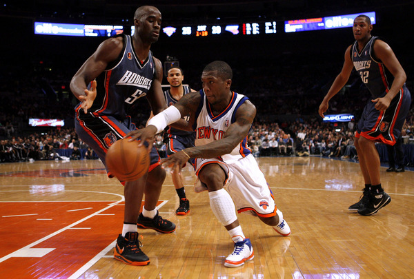 March 2010, New York, N.Y. - New York Knicks #4 Nate Robinson, center, passes inside against Charlotte Bobcats #50 Emeka Okafor, left, as #32 Boris Diaw looks on during an NBA basketball game at Madison Square Garden. : Sports Singles : Jason DeCrow Photojournalist