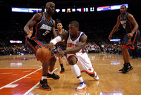 March 2010, New York, N.Y. - New York Knicks #4 Nate Robinson, center, passes inside against Charlotte Bobcats #50 Emeka Okafor, left, as #32 Boris Diaw looks on during an NBA basketball game at Madison Square Garden.