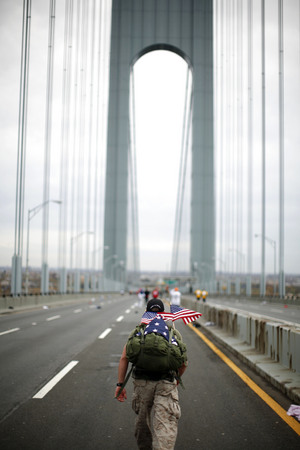 November 2009, Staten Island, N.Y. - A runner crosses the Verrazano Narrows Bridge at the start of the ING New York City Marathon.  : Sports Singles : Jason DeCrow Photojournalist