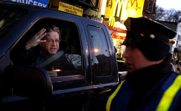 December 2005, NYC - A motorist angrily confronts a police officer at a traffic checkpoint during a system-wide mass transit strike that left city traffic gridlocked. : Singles : Jason DeCrow Photojournalist