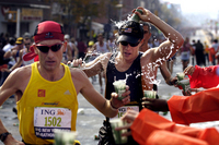 November 2005, NYC - Runners hydrate as they make their way through Brooklyn during the New York City Marathon. - © All images copyright Jason DeCrow
