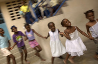 Young girls play at an orphanage in Delmas.