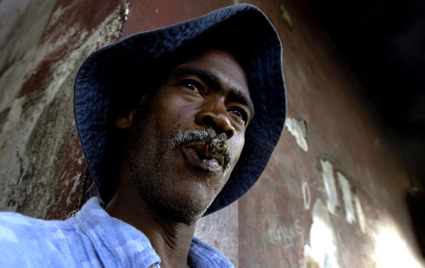 "I pray to God Preval will be elected," says Carlos, an unemployed fisherman. : Haiti 2006 : Jason DeCrow Photojournalist