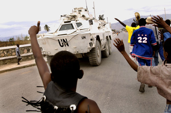 UN peacekeepers patrol Cite Soleil during a rally for presidential candidate Rene Preval. : Haiti 2006 : Jason DeCrow Photojournalist