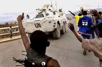 UN peacekeepers patrol Cite Soleil during a rally for presidential candidate Rene Preval.