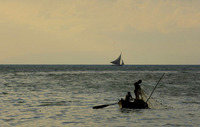 Fisherman pull up their nets at sunset in the waters off Port-au-Prince.