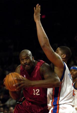 February 2006, NYC - The Miami Heat's Shaquille O'Neal, left, muscles past the New York Knicks' Maurice Taylor at Madison Square Garden. : Singles : Jason DeCrow Photojournalist