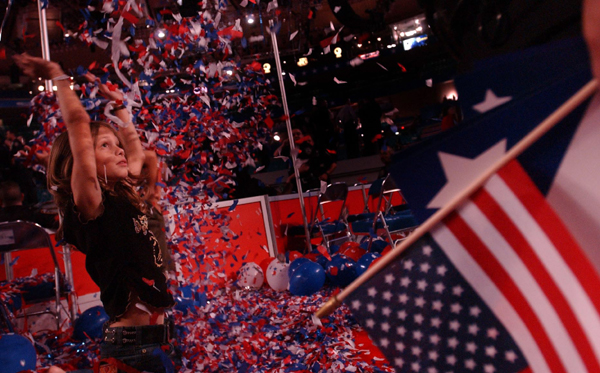 September 2004, New York, N.Y. - More interested in play than politics, Emily Morgan, 10, of Baton Rouge, La., frolics in one of many piles of confetti left after the finale of the Republican National Convention. : News Singles : Jason DeCrow Photojournalist