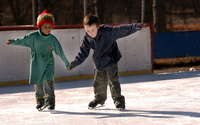 February 2004, Brooklyn, N.Y. - Tsehai Messiah, 5, of Bedford-Stuyvesant, and Shane McGuiness, 7, on holiday from Donegal, Ireland, help each other around Wollman Rink in Brooklyn's Prospect Park.