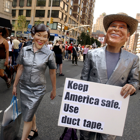 August 29, one day out - Two protestors take the government's advice on public safety to extremes during the United For Peace and Justice Rally on Seventh Avenue in Manhattan. : GOP in NYC 2004 : Jason DeCrow Photojournalist