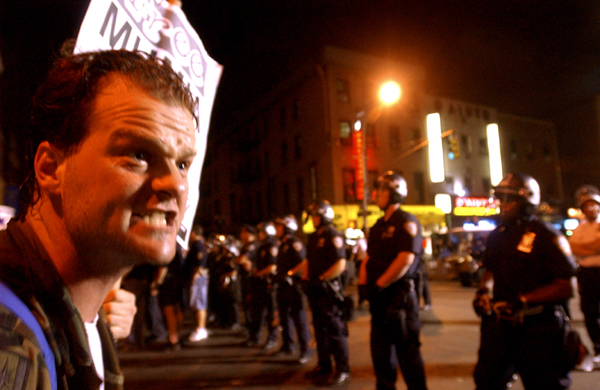 August 30, day one - A furious protester rages against riot police during a demonstration on Eighth Avenue near Madison Square Garden. : GOP in NYC 2004 : Jason DeCrow Photojournalist